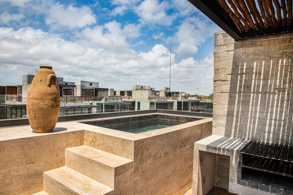 Escape to your exclusive rooftop retreat featuring a refreshing plunge pool, open-air shower, and stylish outdoor space designed for ultimate relaxation.