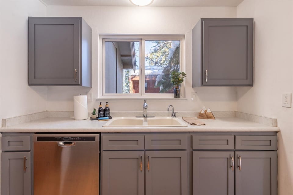 Enjoy all the kitchen amenities including a dishwasher and provided soaps and sponges.