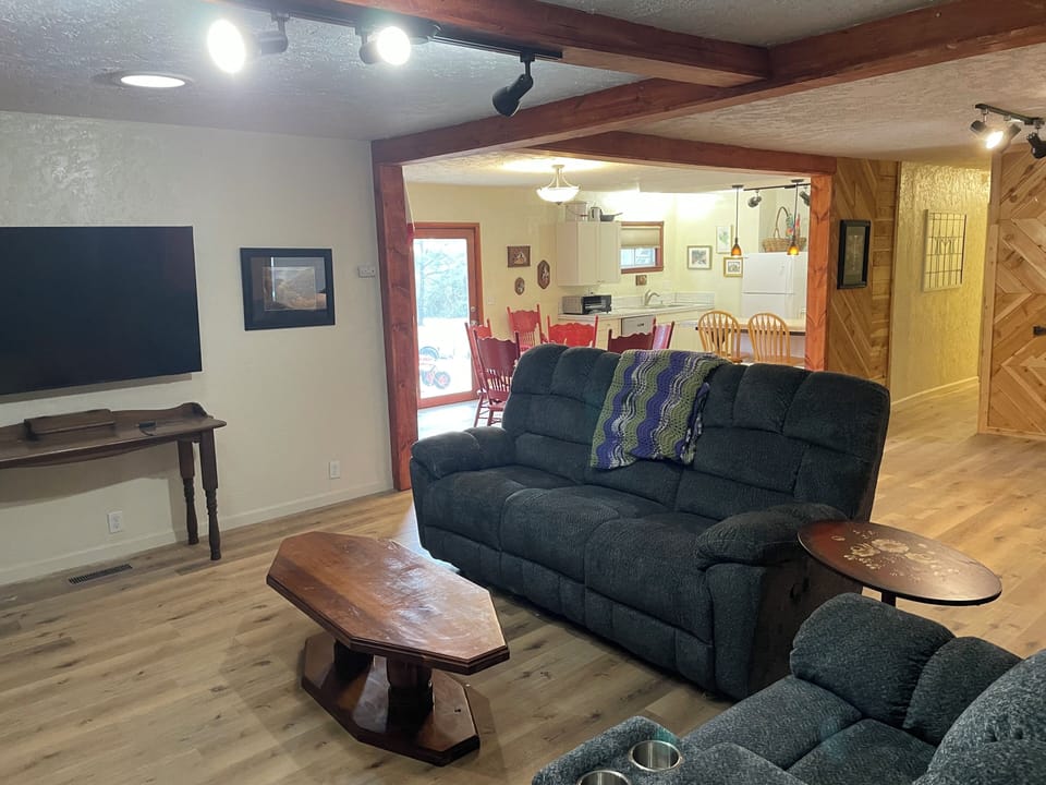 Living/fireplace room with 65" Samsung smart tv.