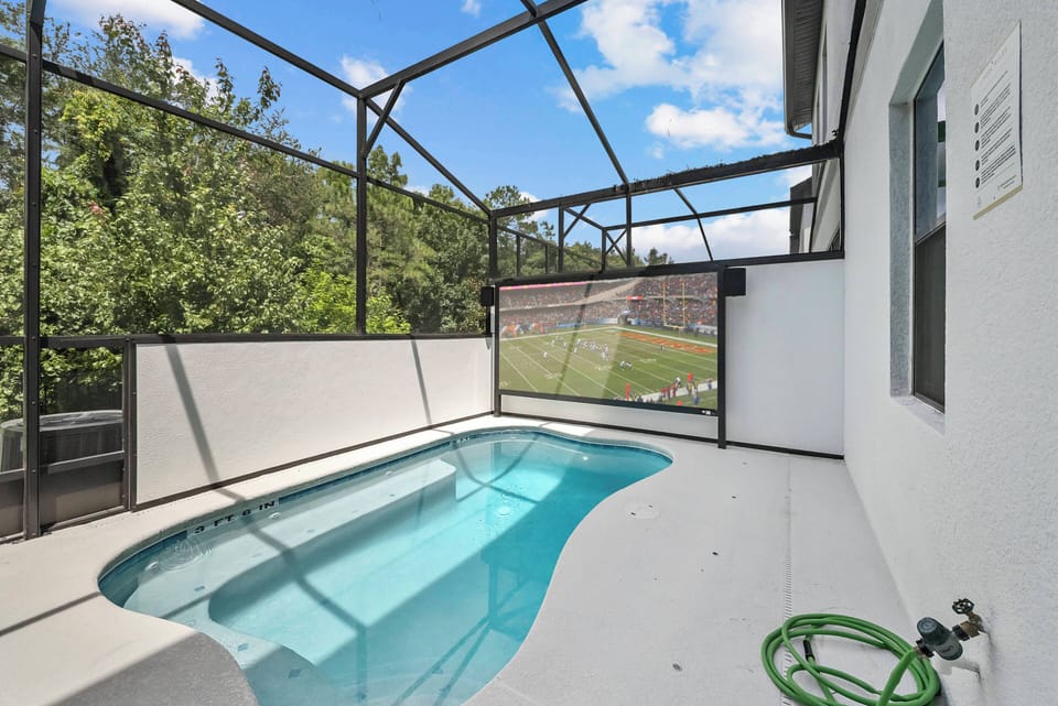 Step outside to your private pool area, where a sparkling pool awaits, framed by sleek white walls. Surrounded by lush greenery, this tranquil space is perfect for unwinding and soaking up the sun. Enjoy your serene escape!