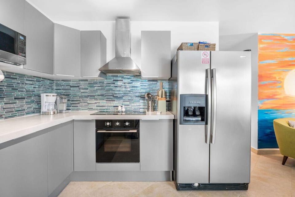 Freshly upgraded kitchen offering an oven, refrigerator and freezer, microwave, coffee maker, and everyday necessities.