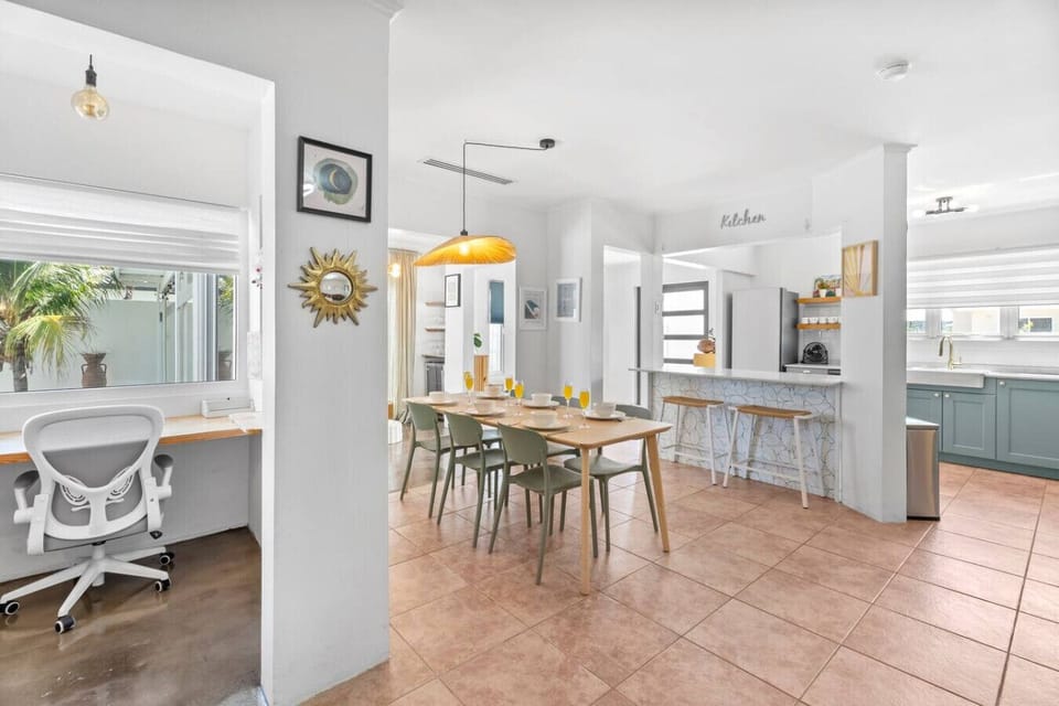 Open-concept living with a dedicated office space, spacious dining area, and fully equipped kitchen. Designed for productivity, connection, and effortless group living.