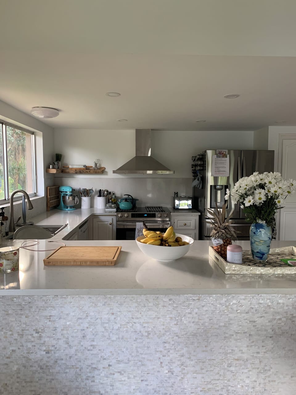 Huge open kitchen light and bright new appliances and quartz countertops