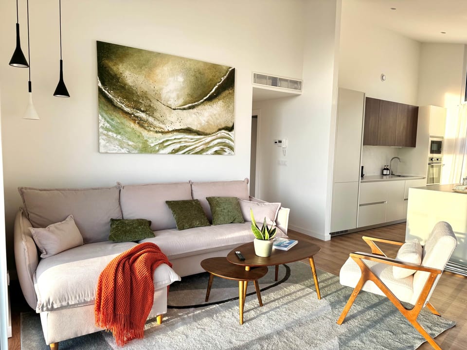 Open-plan living, dining, and kitchen space filled with natural light.