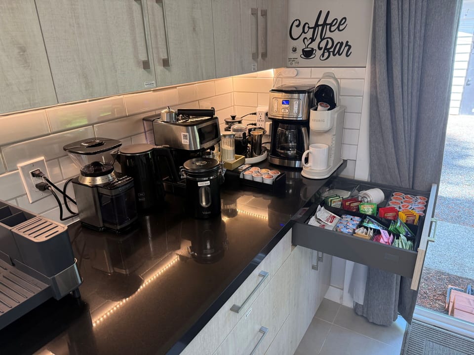 Full coffee/tea station w/espresso, Keurig, drip, etc. Coffee & tea included.