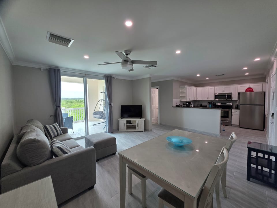 Spacious and comfortable dining and living room spaces with exit to patio