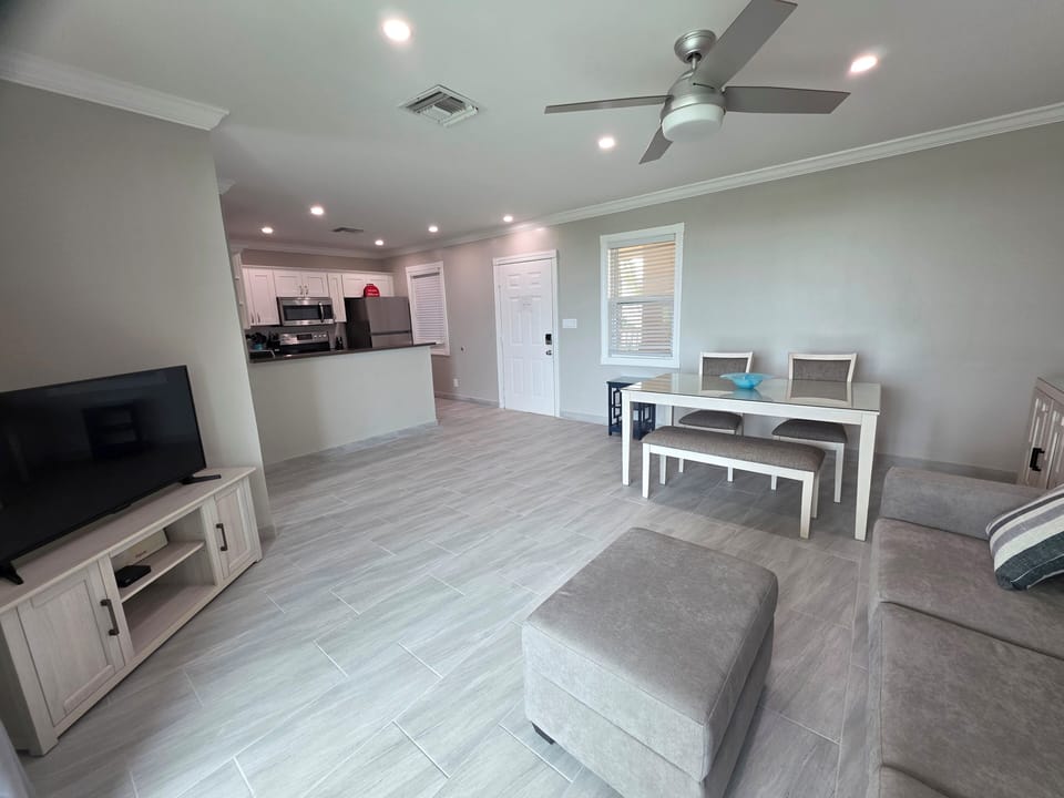Smart, flat screen TV with cables for indoor entertainment.