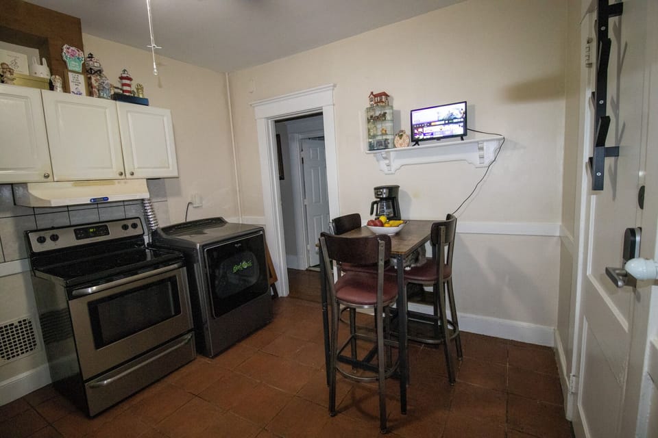 Features a high table for quick bites and a convenient TV