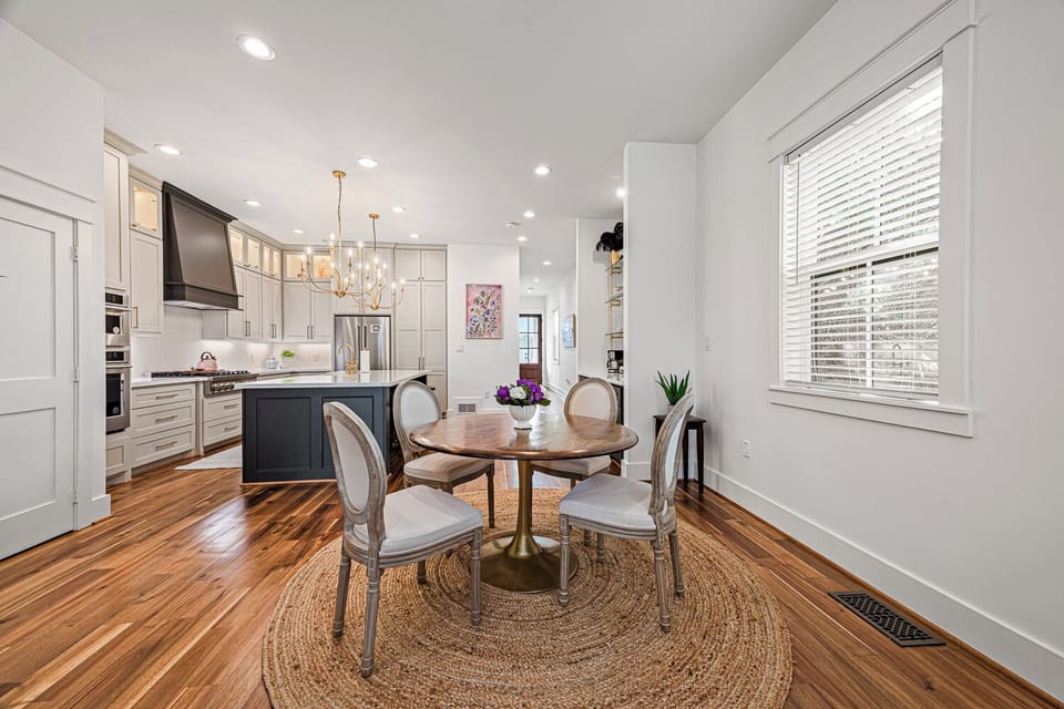 Enjoy the bright, open-concept flow from dining nook straight into the fully equipped luxurious kitchen. 