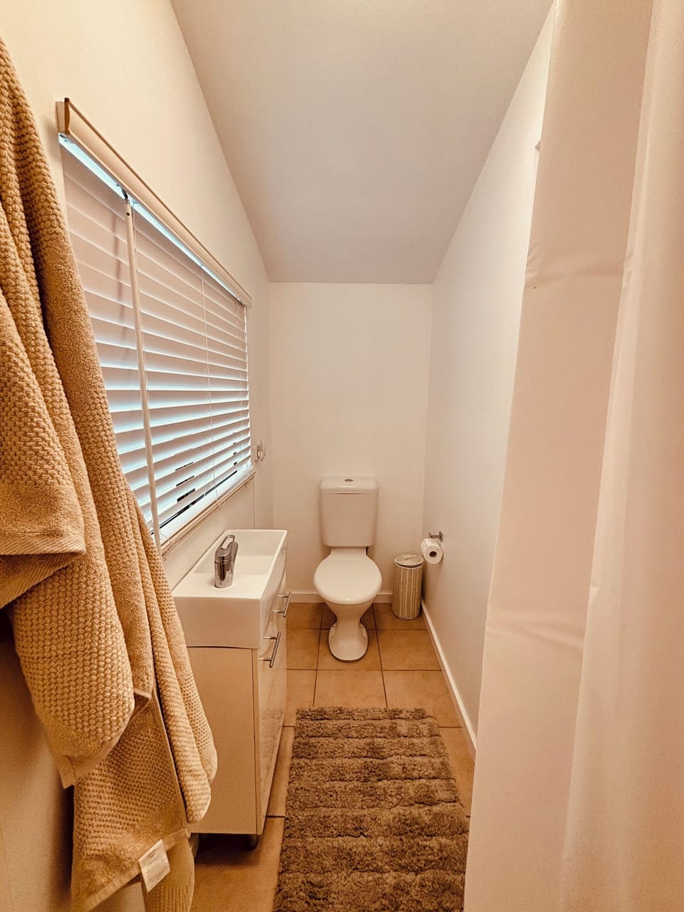 Compact bathroom with wash basin & shower