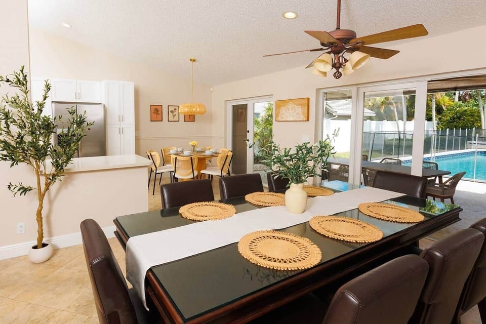 Our dining area features a large table perfect for family gatherings and holiday feasts. Additionally, there's a smaller table in a well-lit corner, ideal for casual meals or morning coffee.