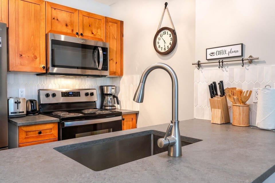 Fully equipped kitchen with modern appliances for easy in-suite cooking.