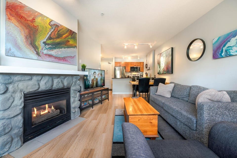 Sink into the sofa and enjoy the soft glow of the gas fireplace.