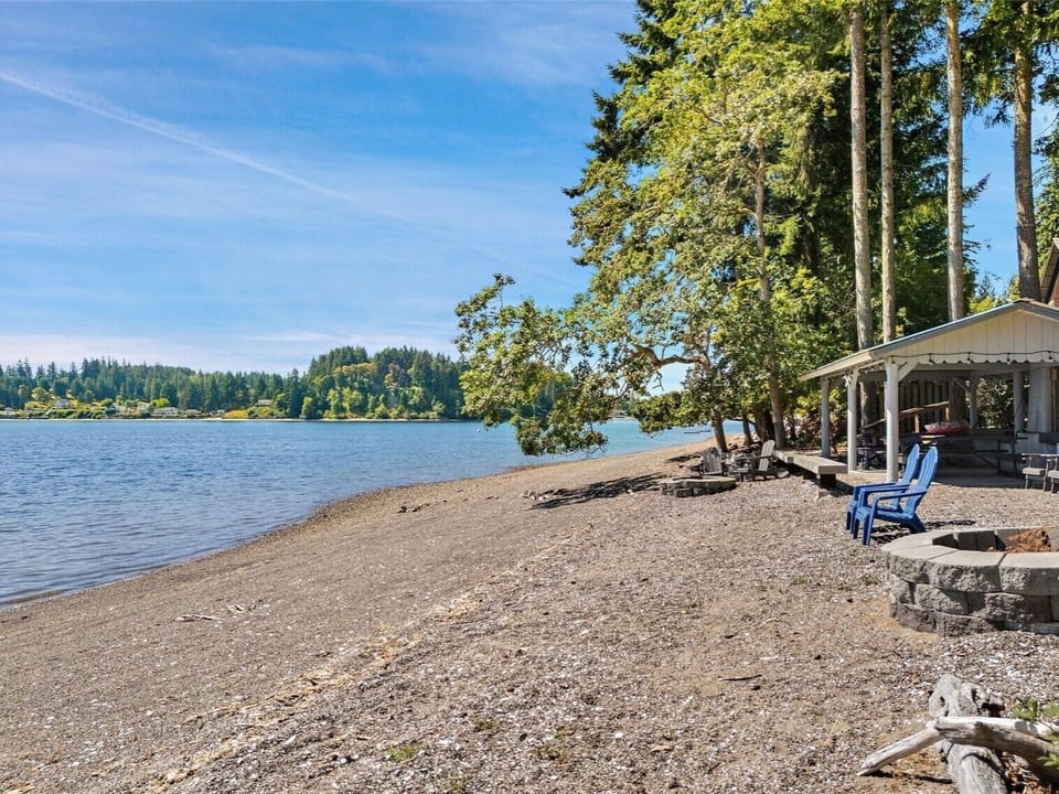 Shared beach on SE end of the island has fire pit, Adirondack chairs, table
