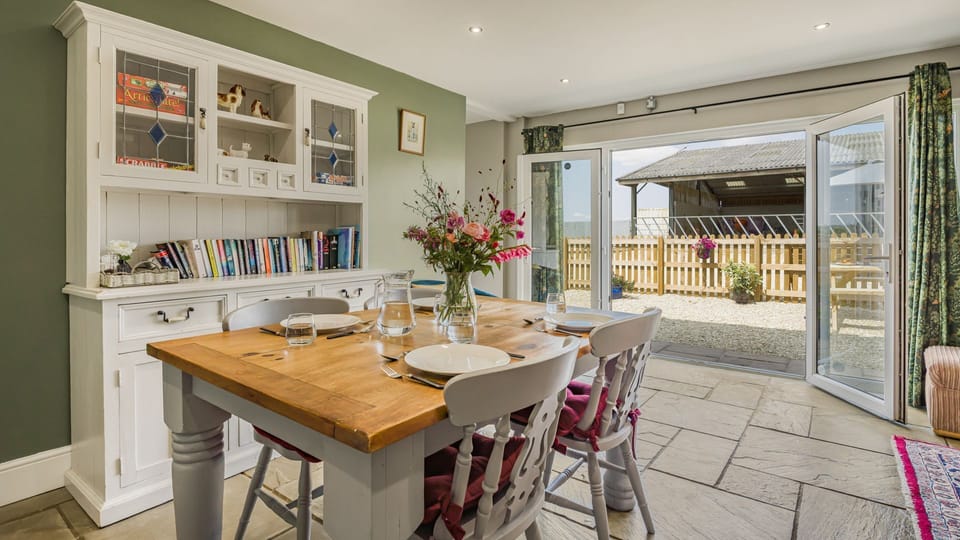Enjoy mealtimes in the barn's stylish, country-chic dining area.