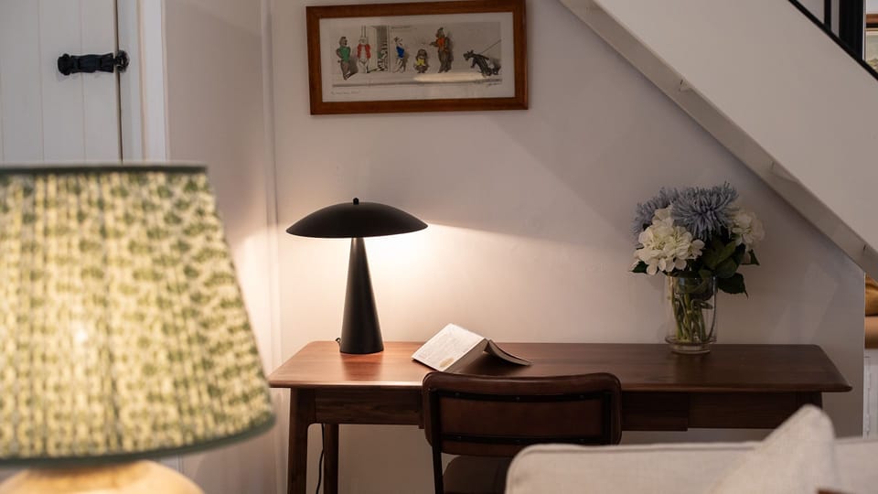 Secluded under the stairs is a desk if you need to set up your laptop while here.