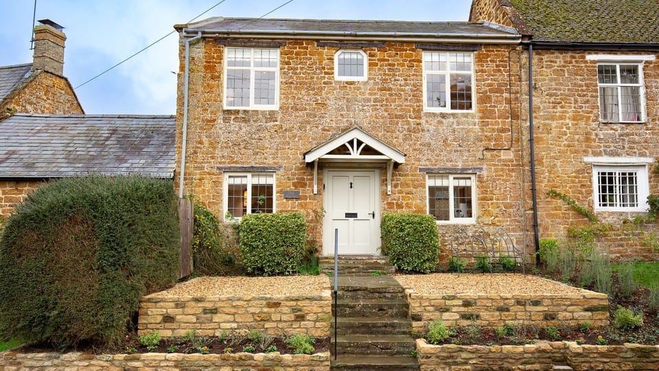 Oak Cottage has a south facing front garden with two benches and a coffee table.