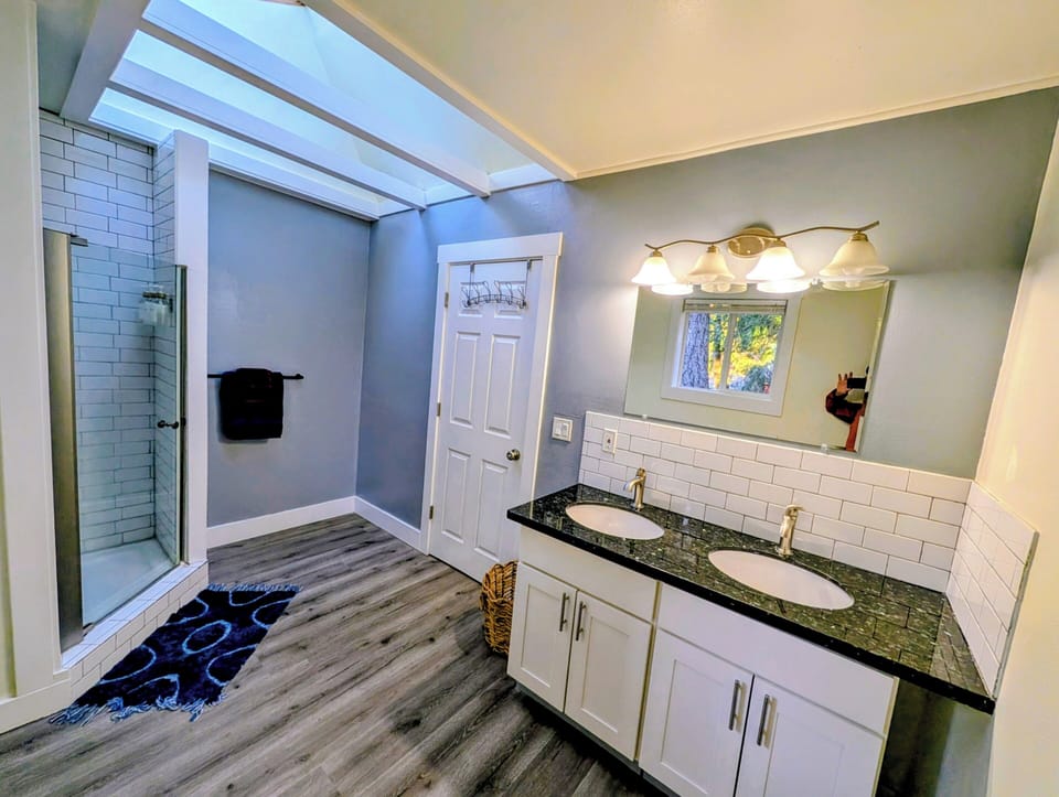 Master bedroom en suite bathroom with dual sinks.
