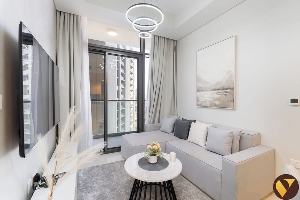 Luxury Apartment, Balcony, Pool View | Living area | 65-inch Smart TV with cable channels