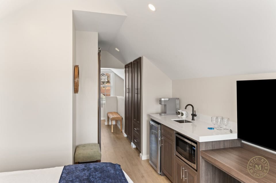 Light and airy: The hallway connects the sleeping quarters, featuring natural light and historic charm