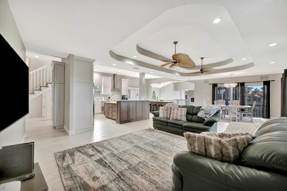 Open-Concept Living Room Flowing into Chef’s Kitchen and Island Seating