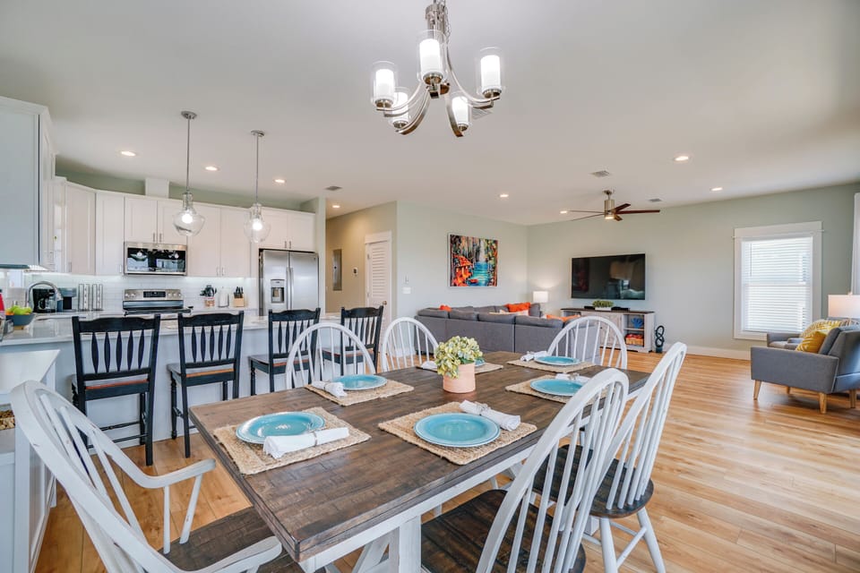 Gather around your beautiful dining table for meals and memories, with the open kitchen and cozy living area creating perfect flow for togetherness.