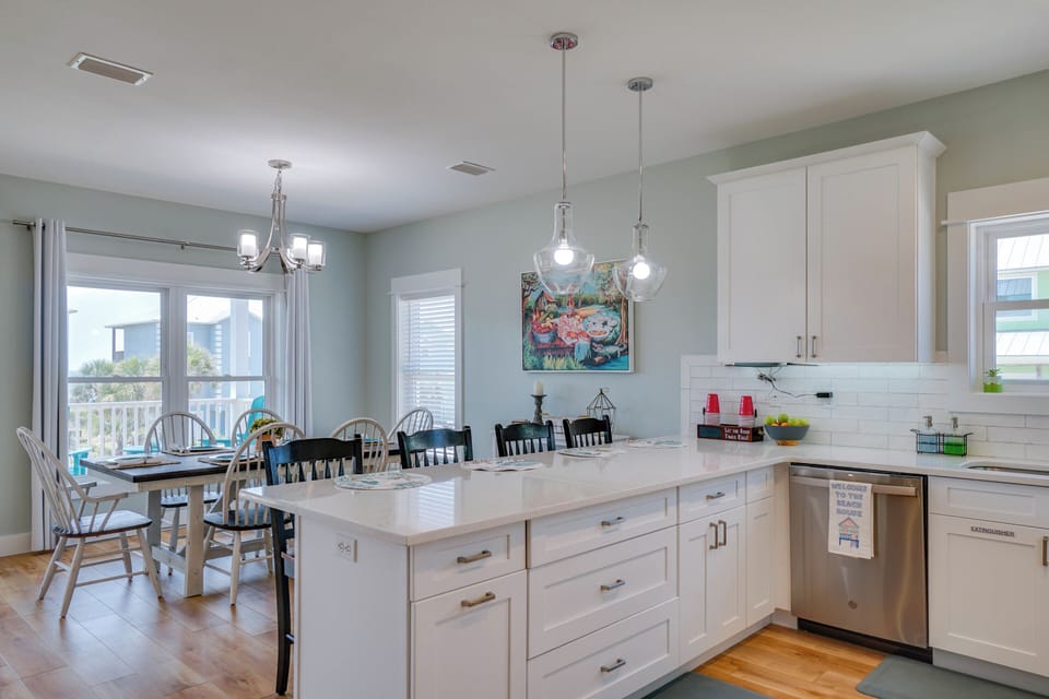 Your spacious kitchen island becomes the heart of memorable meals, with pendant lighting creating perfect ambiance for cooking and gathering together.