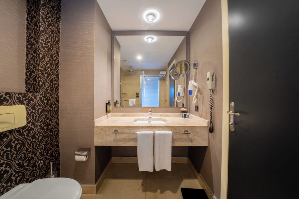 Double Room, Sea View | Bathroom | Shower, eco-friendly toiletries, hair dryer, towels