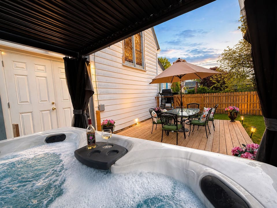 This lovely hot tub in the backyard will be the ultimate relaxation spot.