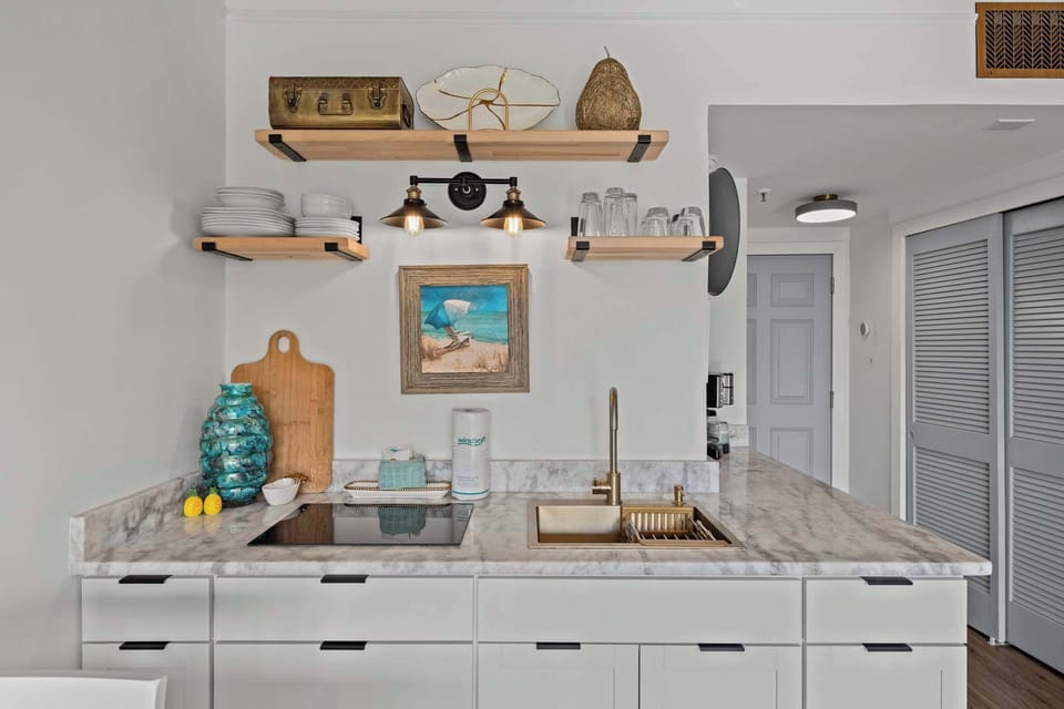 Our kitchenette includes a fridge, induction cooktop, microwave, pots & pans, silverware, utensils, and a standard coffee pot and Keurig for coffee lovers.