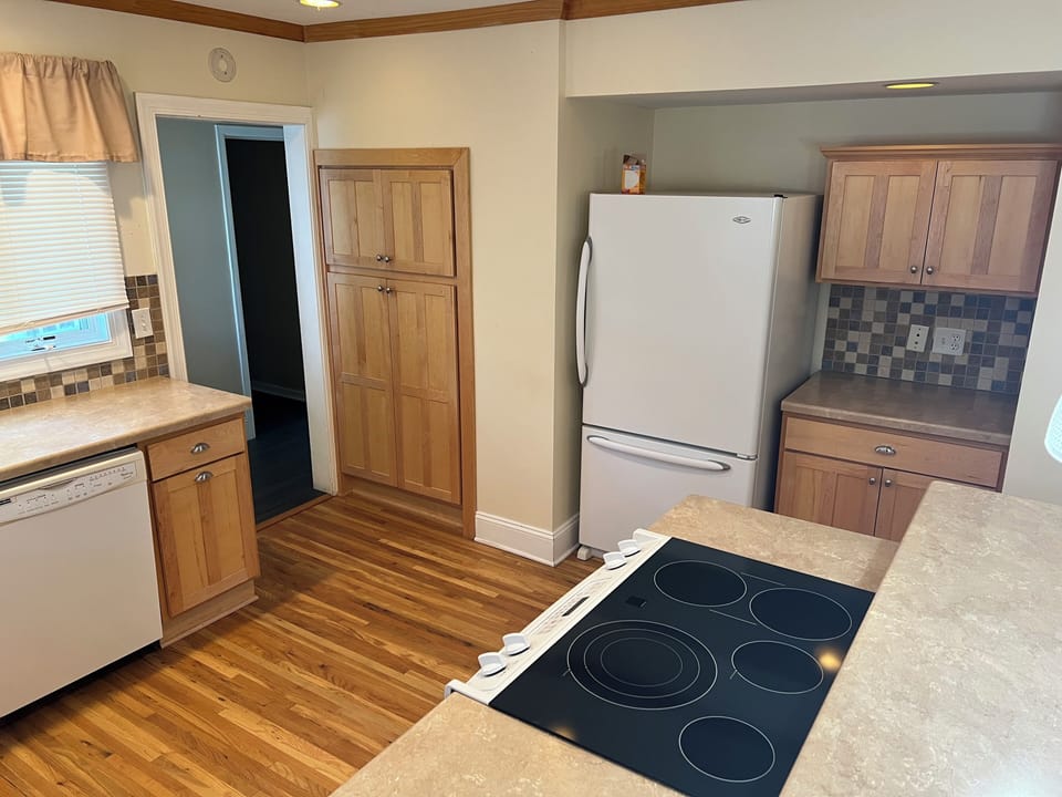 Full kitchen with basic cooking and dining essentials. 