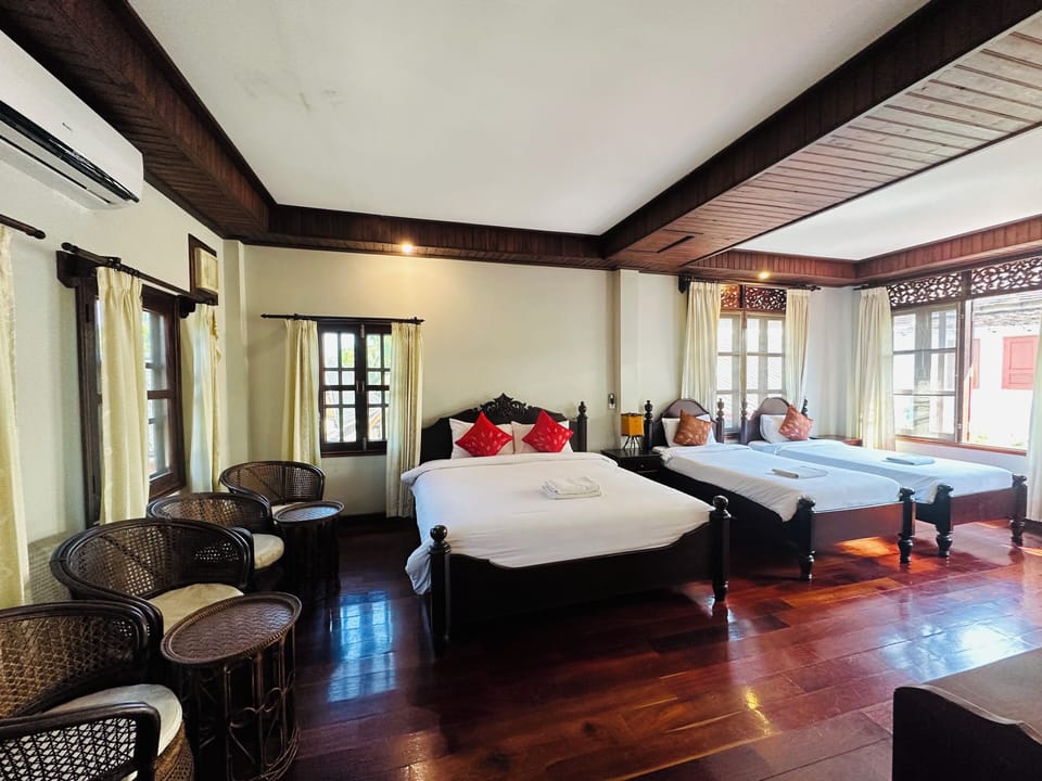 Deluxe Quadruple Room, Courtyard View | Premium bedding, Select Comfort beds, free minibar items, desk