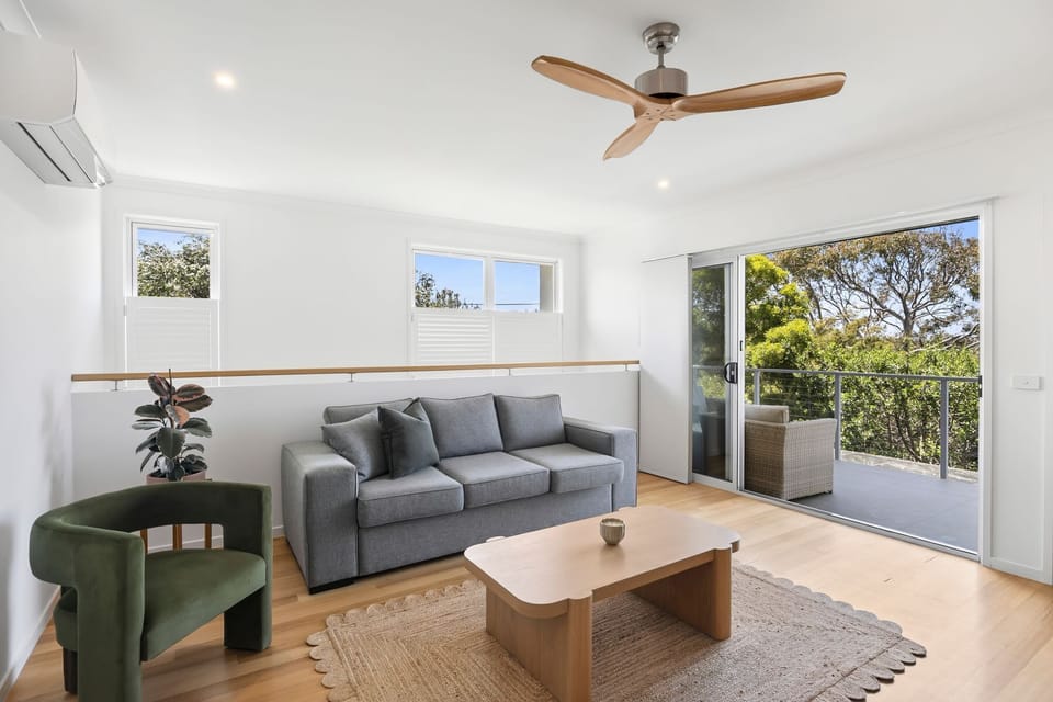Second Lounge Room with TV and Views to the ocean just a hop skip and jump away!