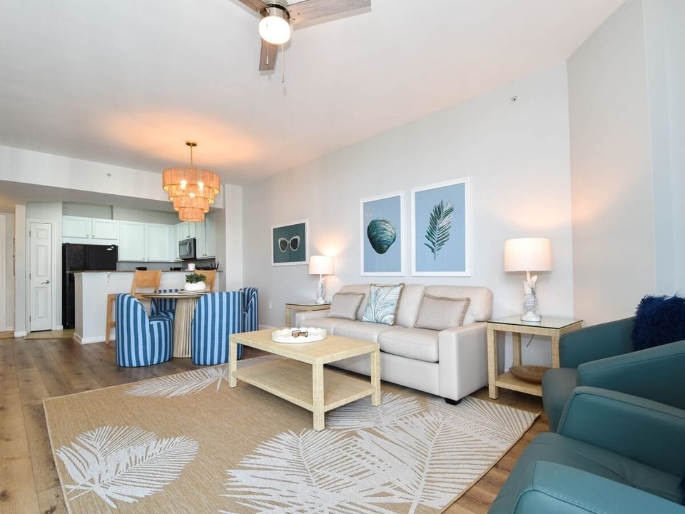 Comfortable living room w/ plush sofa, coastal accents, and space to unwind together.