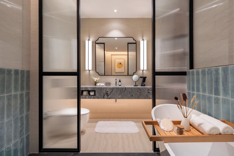 Separate tub and shower, rainfall showerhead, hair dryer, slippers