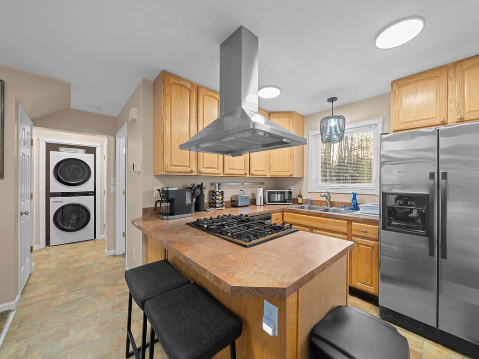 This functional kitchen has stainless appliances and a gas range/oven. Enjoy!