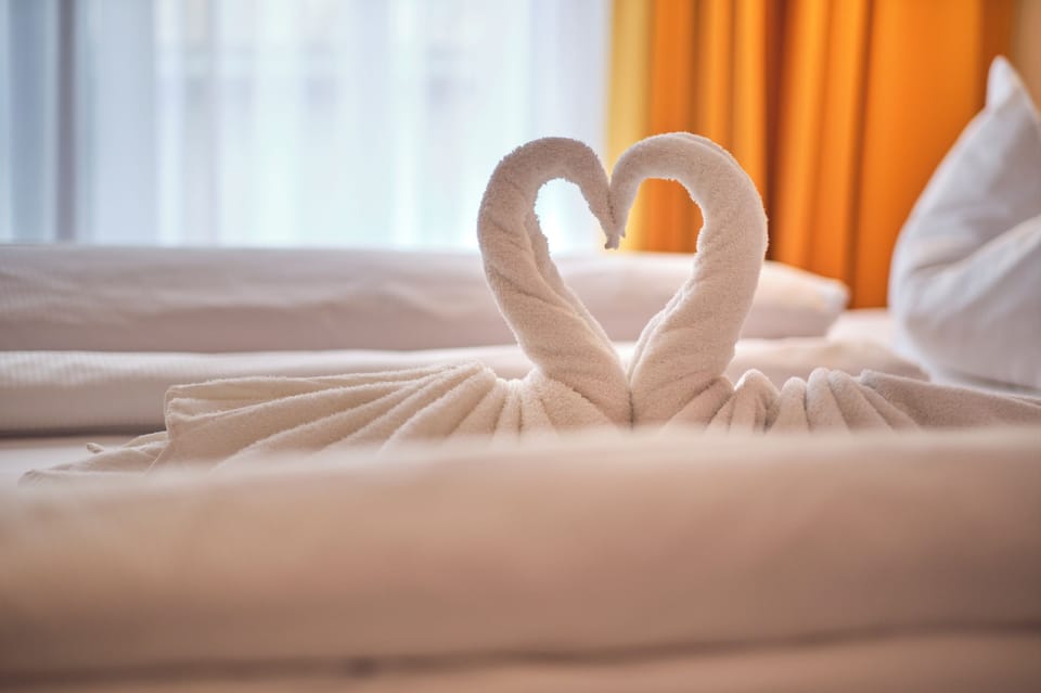 Hypo-allergenic bedding available, in-room safe, desk, laptop workspace