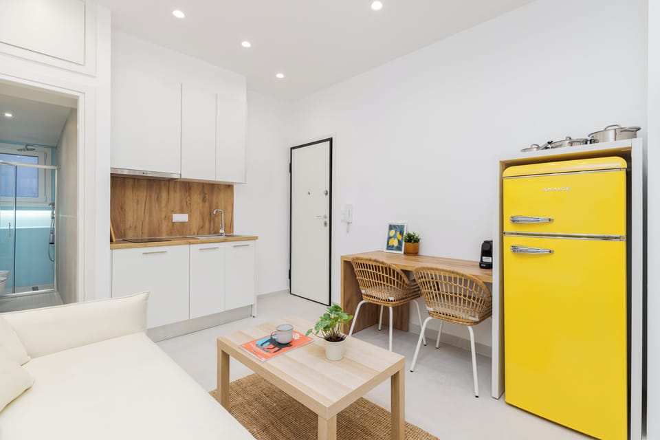 Superior Studio, Balcony, City View | Living area | Flat-screen TV