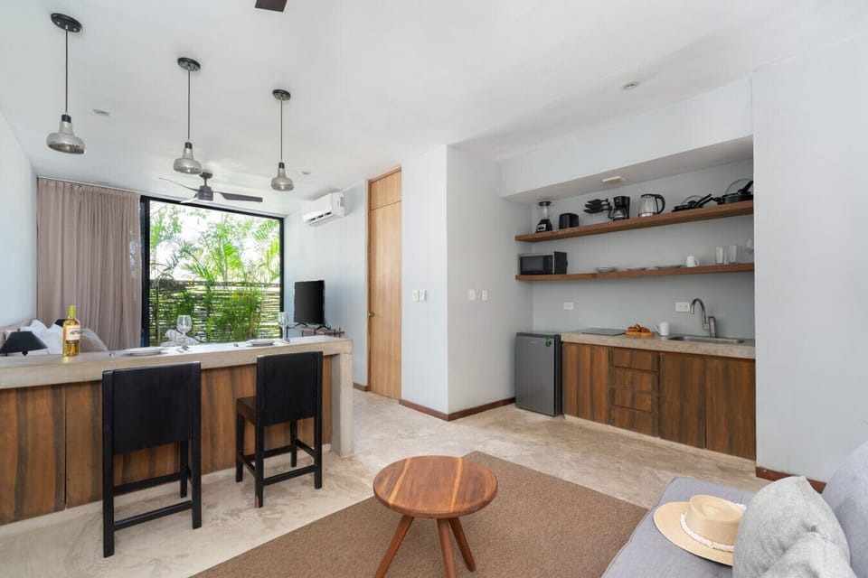 Kitchen and dining area with wide windows and everything for a great stay.