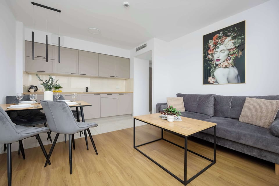 The combined dining and living area forms a harmonious space for shared moments, supporting both conversation and relaxation.