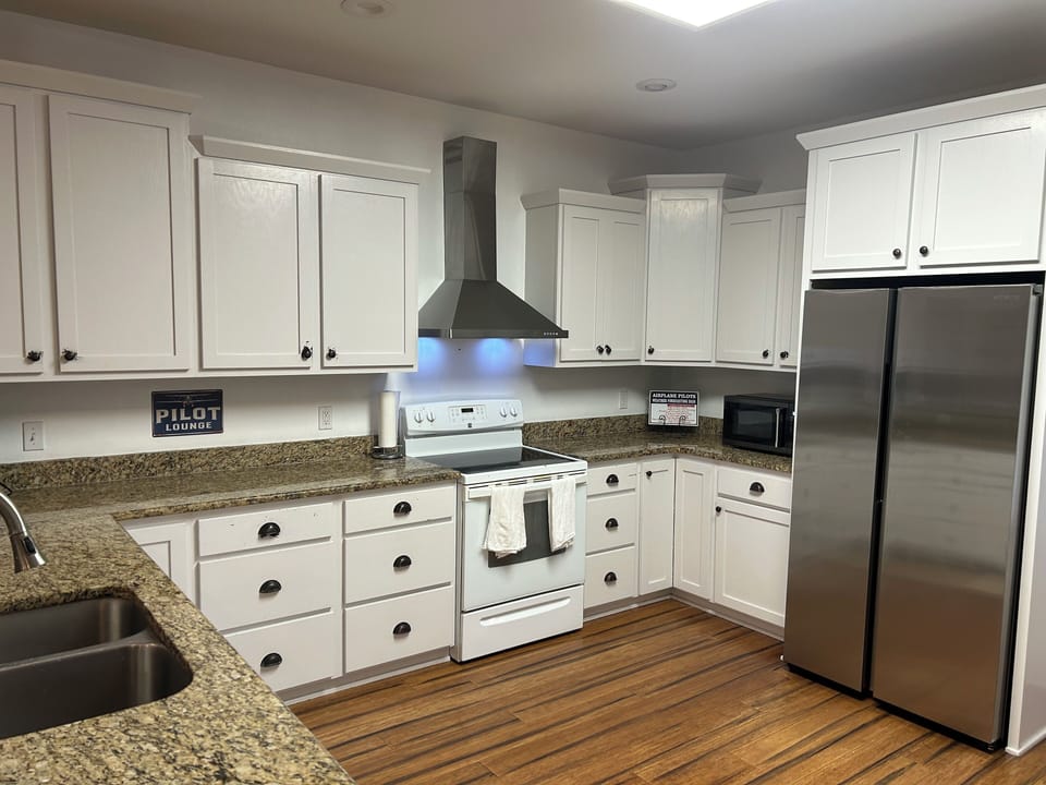 Fully stocked kitchen with dishwasher