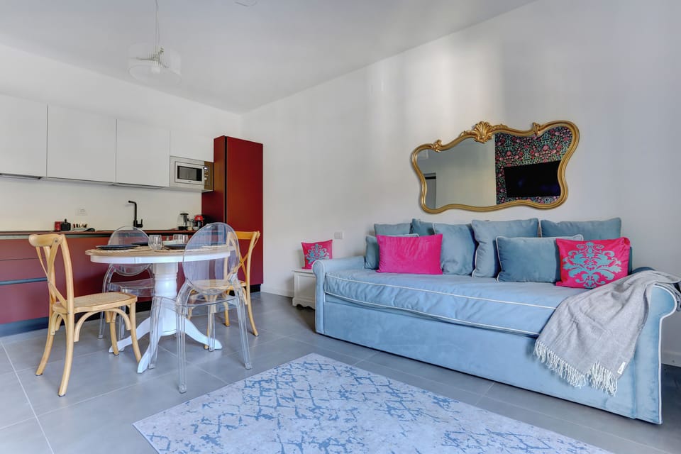Apartment, Balcony, Mountain View | Living area | Flat-screen TV