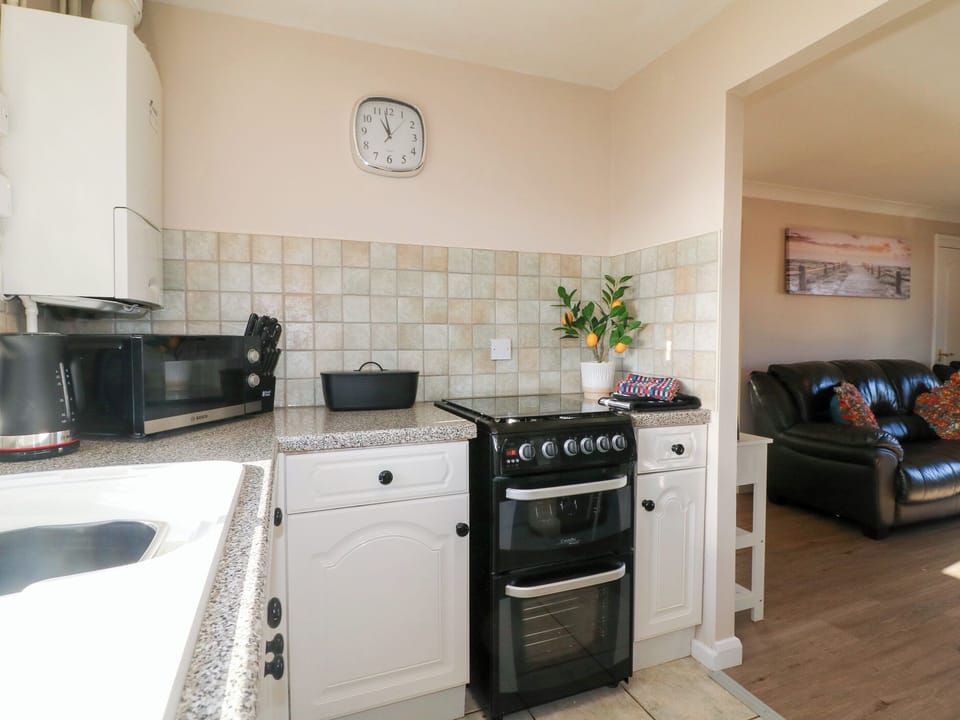 Fridge, microwave, toaster, cookware/dishes/utensils