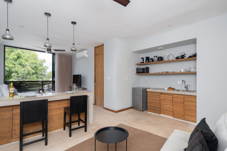 Bright kitchen-dining area with chic décor and plenty of natural light.