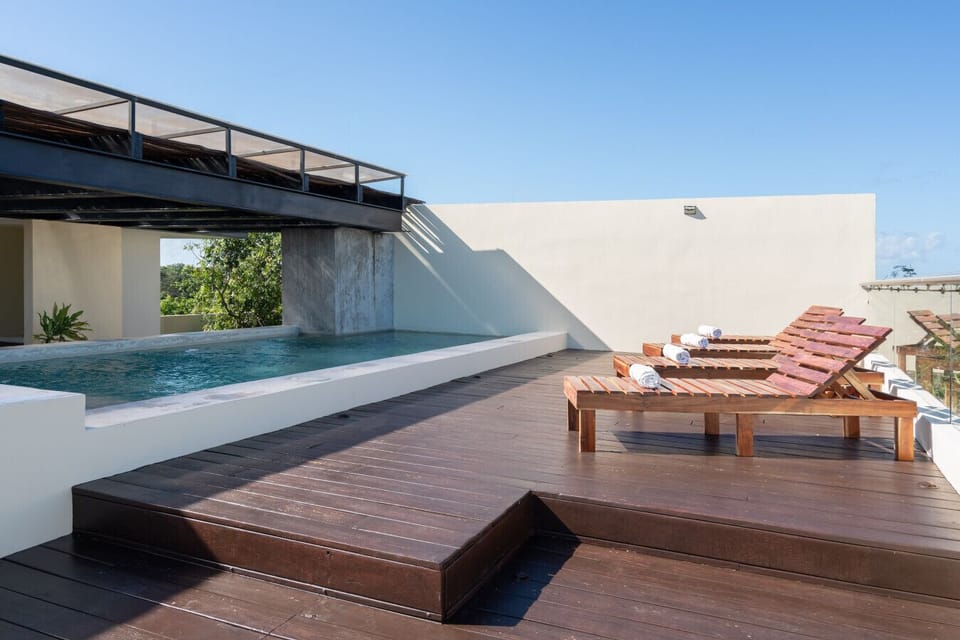 Rooftop terrace with pool views—your perfect spot to relax under the open sky.
