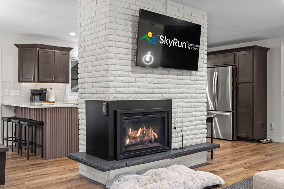 Living room has smart TV and gas fireplace