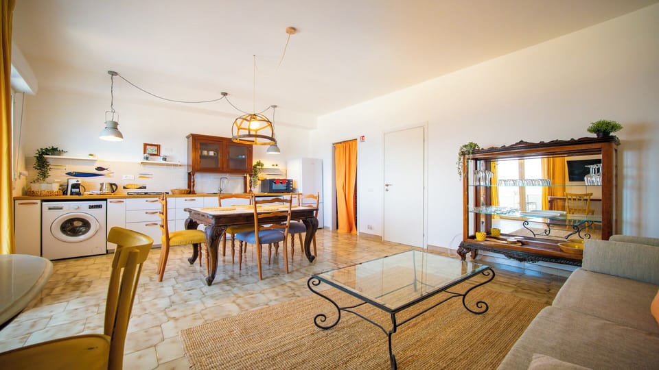 Apartment, Sea View | Living area | 32-inch flat-screen TV with cable channels