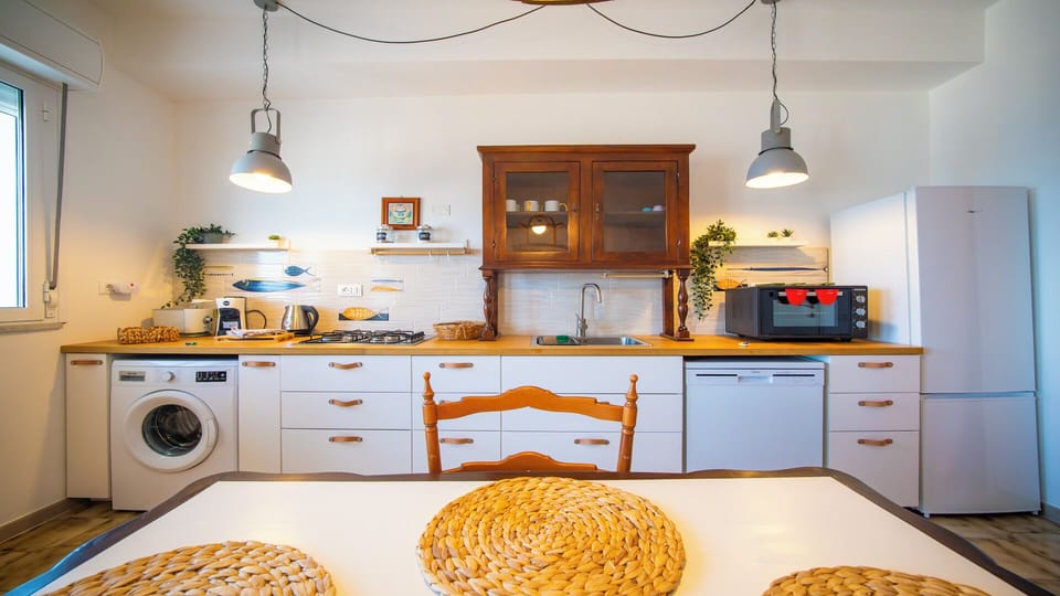 Apartment, Sea View | Living area | 32-inch flat-screen TV with cable channels
