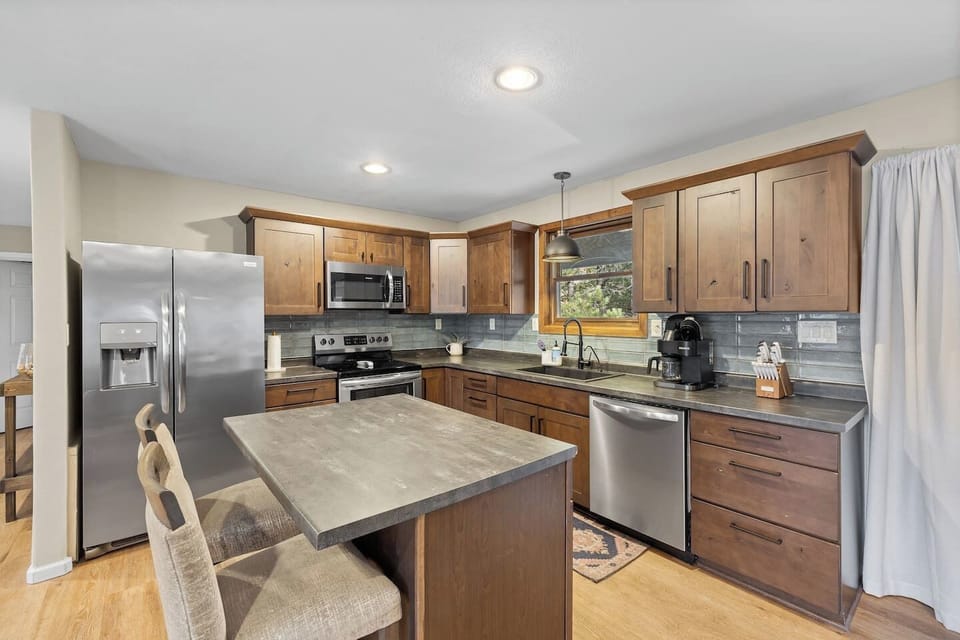 Chef`s dream! Full stainless appliance suite and abundant stone counter space. Everything you need to cook is right here, including a convenient breakfast bar.