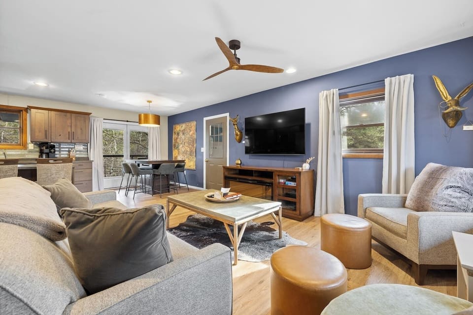 Open-concept design seamlessly connects the living room, dining, and kitchen spaces.